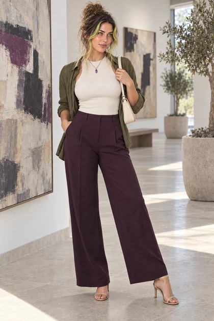 Octavia in cream, olive and plum tailoring in a contemporary gallery